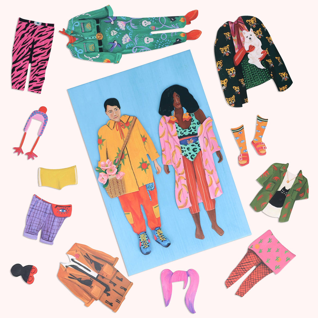 Close-up of interchangeable outfits and accessories for dolls