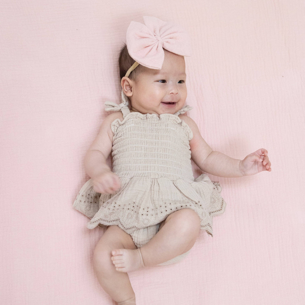 Baby Girl Muslin Smocked Bubble Romper | Beige